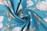 Swirled swatch Blue Large Floral fabric (medium light blue fabric with large tossed white/cream/tan colour scheme floral heads and stems with leaves)