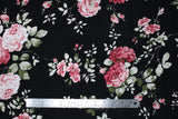 Flat swatch Black fabric (black fabric with fabric with large tossed pink peony look floral and greenery design)
