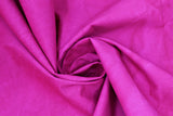 Swirled swatch aged look muslin cotton fabric in shade Magenta