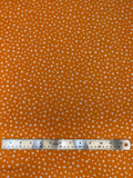 Flat swatch microprint flannel in dainty flowers on orange (white tiny flower heads)