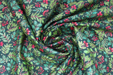 Swirled swatch Foliage Scatter fabric (black fabric with tightly packed tossed design of assorted green foliage/leaves and sprigs with red holly berries)