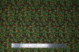 Flat swatch Foliage Scatter fabric (black fabric with tightly packed tossed design of assorted green foliage/leaves and sprigs with red holly berries)