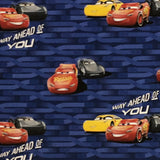 Square swatch Disney's Cars printed fabric (navy blue fabric with subtle racetrack shape design, tossed car characters "Way ahead of you" text)
