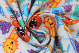 Swirled swatch monsters fabric (light grey fabric with grey swirls and tossed large happy monsters allover in various shapes and orange, blue, teal, purple colours)