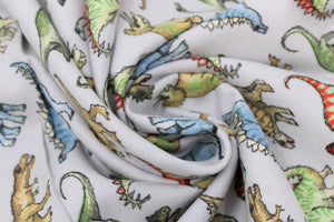 Group swatch dino printed fabrics in various styles/colours
