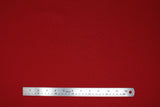 Flat swatch solid upholstery fabric in shade Rojo (red)