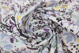 Swirled swatch 100% Organic Cotton fabric (white fabric with black/purple/yellow/faded blue assorted floral pattern)