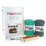Valencia Bag Crochet Kit (stone grey) packaging and contents (balls, hook, straps)