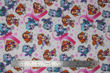 Flat swatch paw patrol themed cotton flannel fabric (white/lightest pink material with tossed pink paw prints and hearts, large Sky and Everest characters in large hearts)