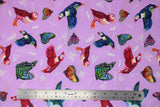 Flat swatch migration themed printed fabric in friends in flight (light purple pastel material with colourful butterflies and birds with subtle white feathers and butterflies in background)