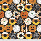 Flat swatch Creepy Crullers fabric (black fabric with halloween themed/decorated donuts and cookies: pumpkins, spiderwebs, eye balls, mummies, etc.)