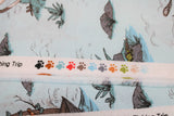 Raw hem swatch cat themed fabric in fishing trip (light blue fabric with tiled cat fishing trip graphics: white and tabby cat fishing in and out of canoe)