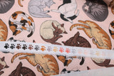 Raw hem swatch cat themed fabric in cat nap (light pink fabric with assorted cartoon napping cats allover)