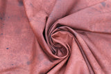 Swirled swatch sienna fabric (rust orange fabric with faint brown/black stain and drip marks)