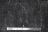 Flat swatch cracked shadow fabric (dark grey/black marbled look fabric with white/neutral crack marks allover and faint black cursive writing)