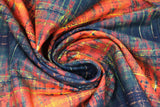 Swirled swatch Saint Concerto fabric (burnt orange and black distressed look fabric with thin subtle yellow lines)
