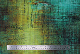 Flat swatch Piano Sorte fabric (blue and green distressed look fabric with colour marbling and subtle black sheet music and text in background)