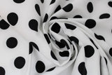 Swirled swatch linework themed fabric in pom poms paper (white fabric with medium sized black polka dots)