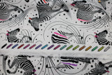Raw hem swatch linework themed fabric in read between the lines (zebras with one stripe a fun colour and wispy stripes, stars printed on white fabric)