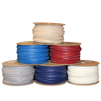 Small rolls of vinyl piping stacked in pyramid form (Bottom Row: Grey, Navy, White, Middle Row: Blue, Red, Top Row: Beige)