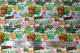 Flat swatch of multi potted cactus printed fabric
