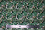 Flat swatch leaves fabric (white fabric with tossed/collaged large green jungle-style leaves with beige and black leaf outlines in background)