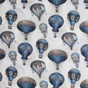 Square swatch nacelle fabric (off white fabric with tossed blue and beige hot air balloons in vintage style, faint circular designs in background)