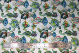 Flat swatch sea creatures fabric (white fabric with medium sized blue and green coloured sea creatures with pink and yellow floral decor fish, turtles, jellyfish)