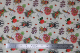 Flat swatch Coleope fabric (off white/beige fabric with large tossed pink and red floral with greenery, large floral decorated insects: bees, dragonflies, beetles and tossed red lady bugs)