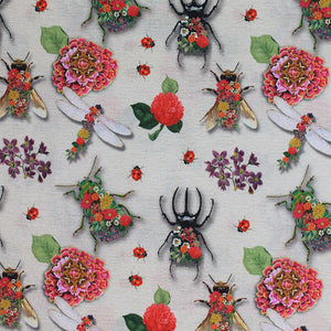 Square swatch Coleope fabric (off white/beige fabric with large tossed pink and red floral with greenery, large floral decorated insects: bees, dragonflies, beetles and tossed red lady bugs) 