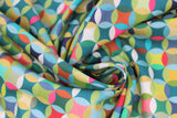 Swirled swatch Caleido fabric (geometric collage look pattern fabric circles allover with diamonds within all in lime green, green, teal, pink, blue, orange colourway)