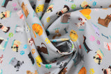 Swirled swatch cats & dogs fabric (grey fabric with small cartoon coloured cats & dogs in different breeds/styles, tossed paw prints in rainbow colours and bones)