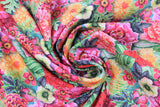 Swirled swatch floral collage fabric (medium sized floral heads in pink, red, yellow, orange with large green leaves)
