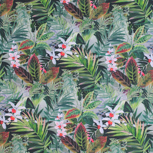 Square swatch Jaya fabric (layered collage of jungle greenery leaves in various shades of green, with some pink/red turning leaves and white and red floral)