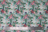 Flat swatch large floral fabric (white fabric with large light blue floral silhouettes allover and repeated floral bouquet style graphics in pink and purple floral with greenery)