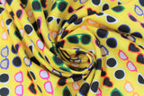 Swirled swatch sunglasses fabric (bright yellow fabric with lines of sunglasses in various shapes/styles in orange, pink, green, blue, white with light and dark lenses)