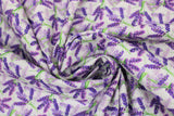 Swirled swatch lavender fabric (white fabric with small tossed purple lavender bouquets with green stems criss crossing over one another pattern repeated allover)
