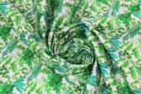 Swirled swatch greens fabric (white fabric with small tossed/collaged greenery, leaves, stems, herbs allover in various styles and shades of green)
