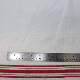 Flat swatch tea towelling material with red stripe accents on white