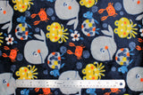Flat swatch (side 1) Poulpy fabric (navy fabric with busy tossed cartoon style happy sea creatures: orange crabs, grey whales, yellow octopi, grey/blue turtles, tossed floral and dot clusters)
