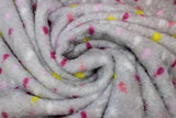 Swirled swatch (side 2) Nimbus fabric (grey fabric with white, pink, purple and yellow raindrops scattered)