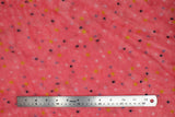 Flat swatch (side 2) Arielle fabric (coral pink fabric with scattered dots in white, black, blue and yellow)