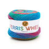 A cake of Lion Brand Ferris Wheel in colourway Sprinkles (twisted strands of peacock blue, pink, turquoise, and gold)