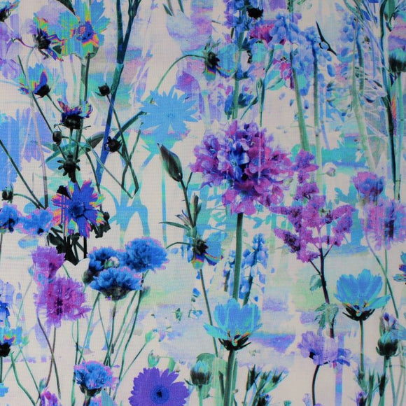Square swatch Garden Bliss: Lily fabric (white fabric with busy collaged/tossed shades of blue and purple monochromatic floral and stems allover)