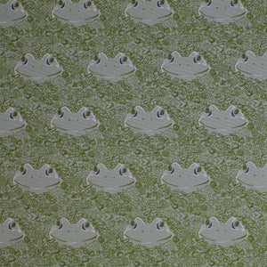 Square swatch Lilliput fabric (pale green fabric with spaced smiling frog heads and tossed dark green doodles allover: floral, bugs, leaves, etc.)