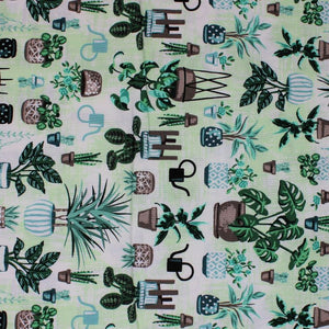Square swatch Patio Sprout fabric (white and pale green marbled look fabric with tossed full colour potted and assorted house plants allover in various styles)