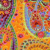 Swatch of paisley jungle printed fabric in tangerine