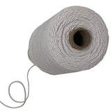 A spool of white elastic twine, partly unrolled