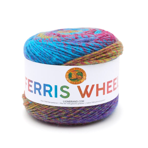 A cake of Lion Brand Ferris Wheel in colourway Vintage Carousel (twisted strands of peacock blue, magenta, gold, and violet) 