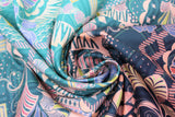 Swirled swatch Wilshire Sunset fabric (busy design allover: geometric shapes, swirls, leaf look shapes, dots, etc. in teal, blue, purple, peach, green light and pale shades)
